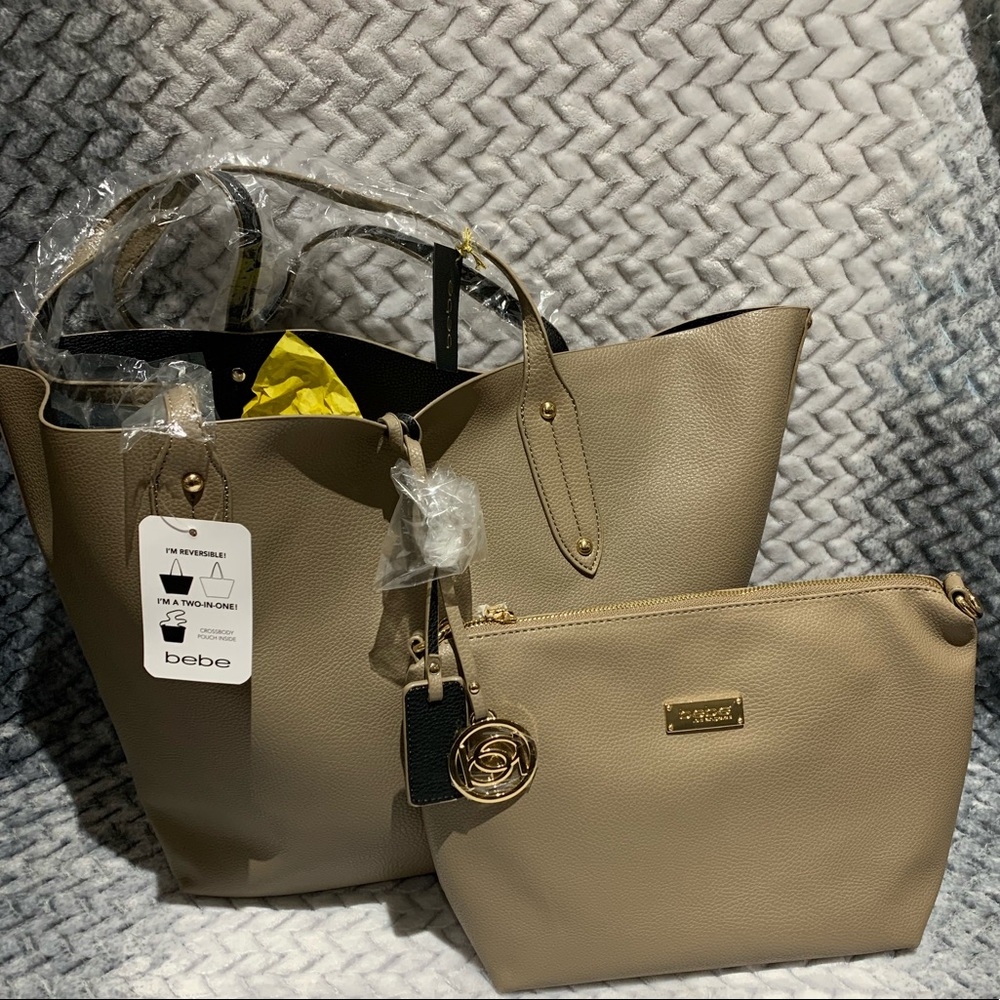 Reversible BEBE purse with a make up purse inside.
